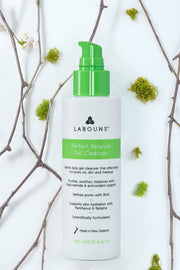 Labouns Perfect Balance Gel Cleanser bottle with green cap on a light background with decorative elements.