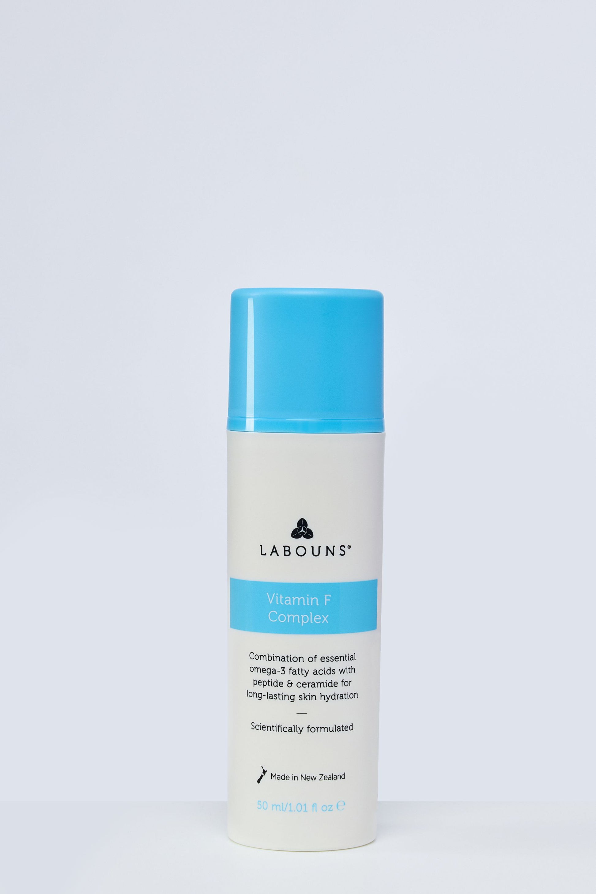 Skincare bottle with blue and white design on a light gray background